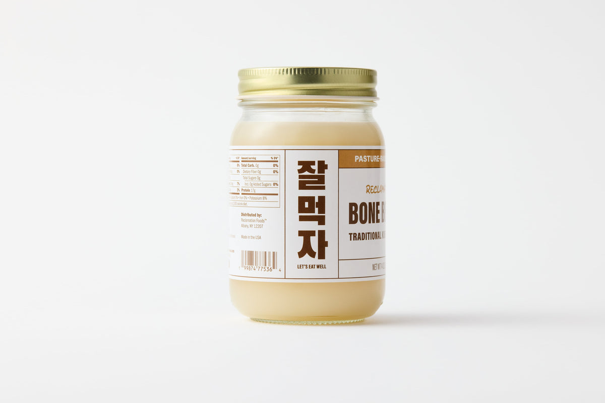 Left sideview of jar of Reclamation Korean-Style Pork Bone Broth on a white background